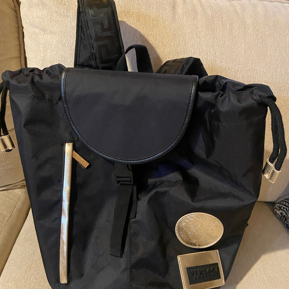 Versace Black and Gold Backpack with Flap-Top Design